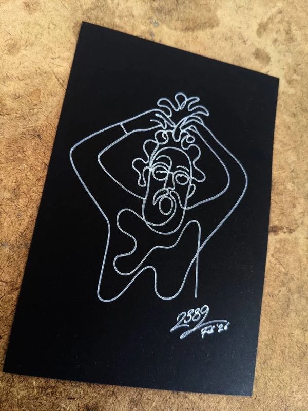 Finished Micasso portrait card drawn with white gel pen on black cardstock, showing an abstract face with a 2389 signature